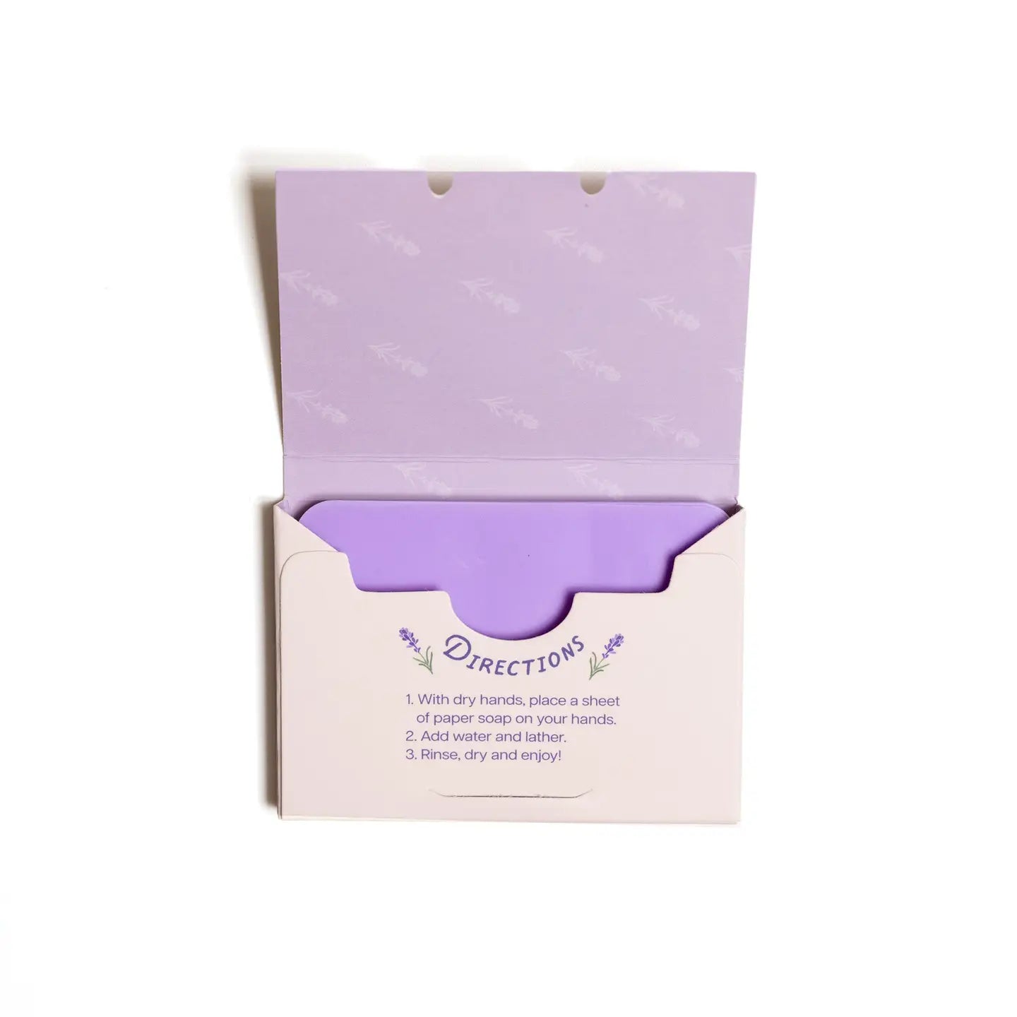Purple paper soap with directions on a white background