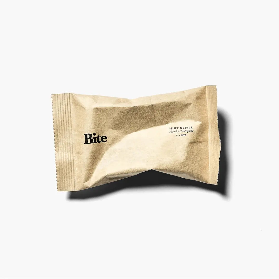 bite toothpaste refill in a brown pouch