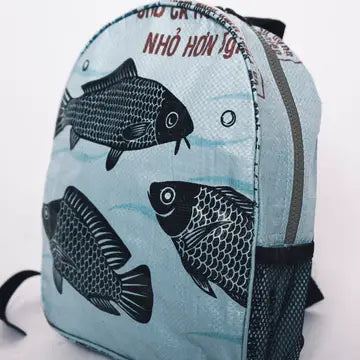 Backpack with fish pattern on a light blue background
