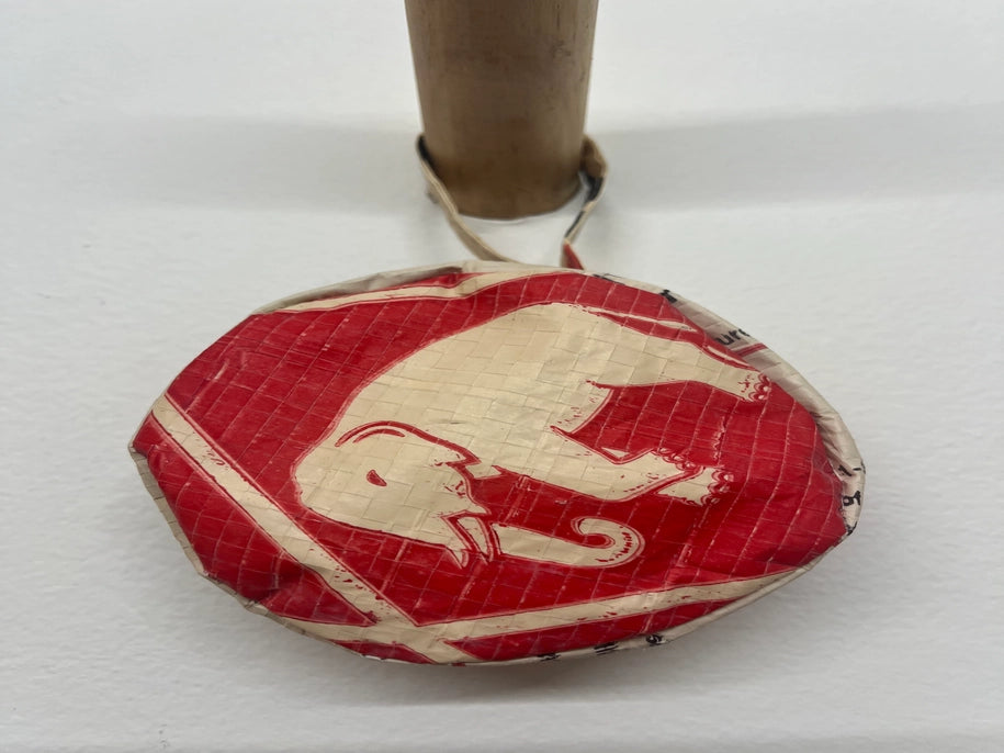 red stash bag with white elephant