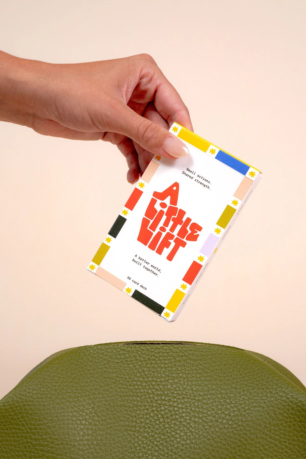 Hand holding a card with &