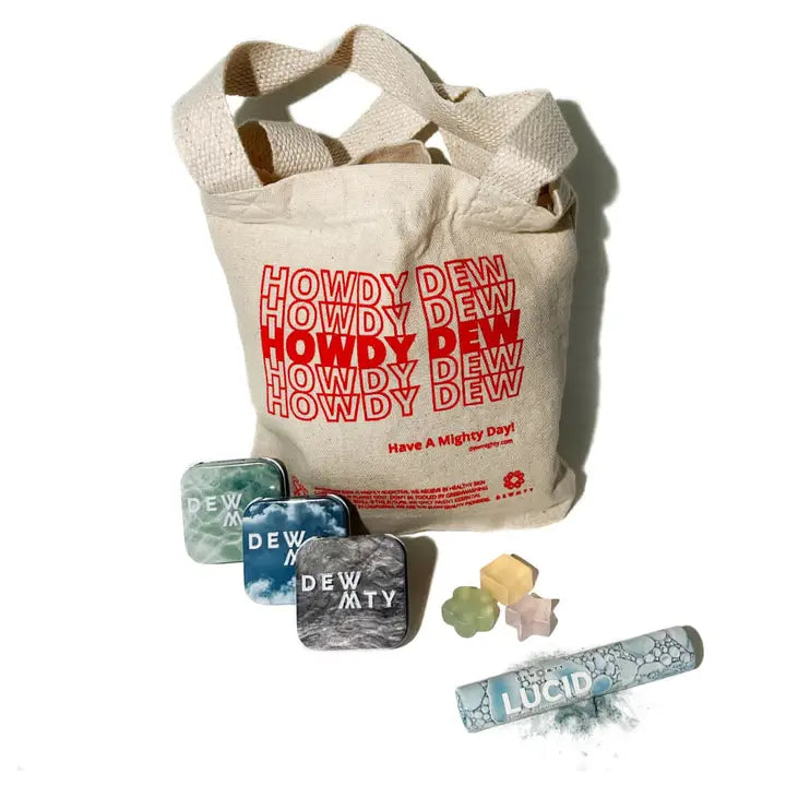 Beige tote bag with red text and various small items on a white background