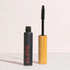 elate mascara container with bamboo wand next to it