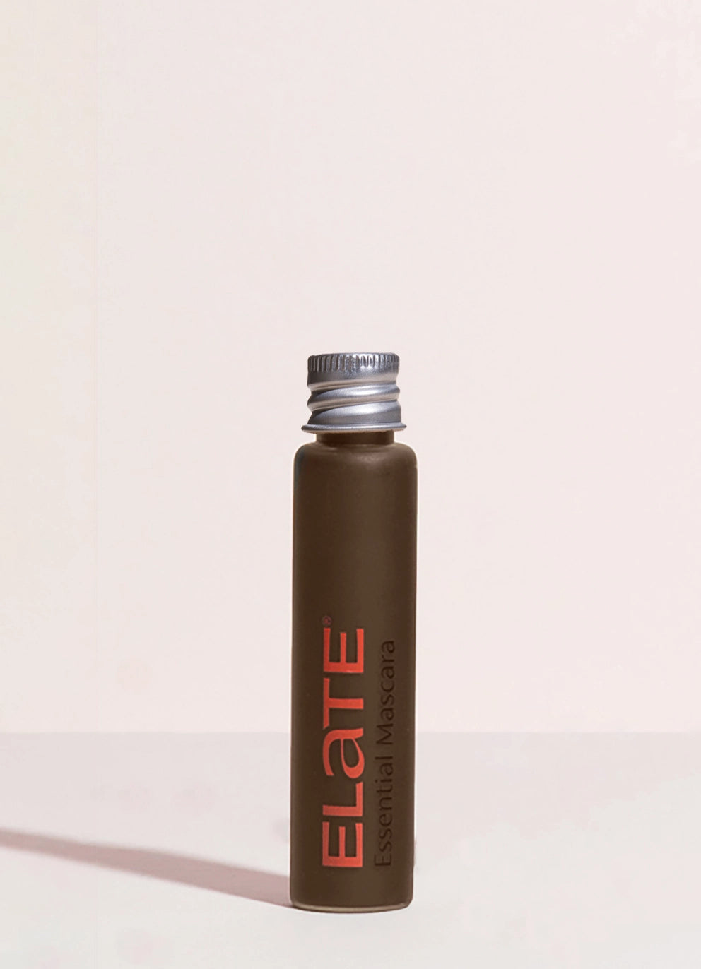 elate mascara in glass with an aluminum lid in brown color for refill