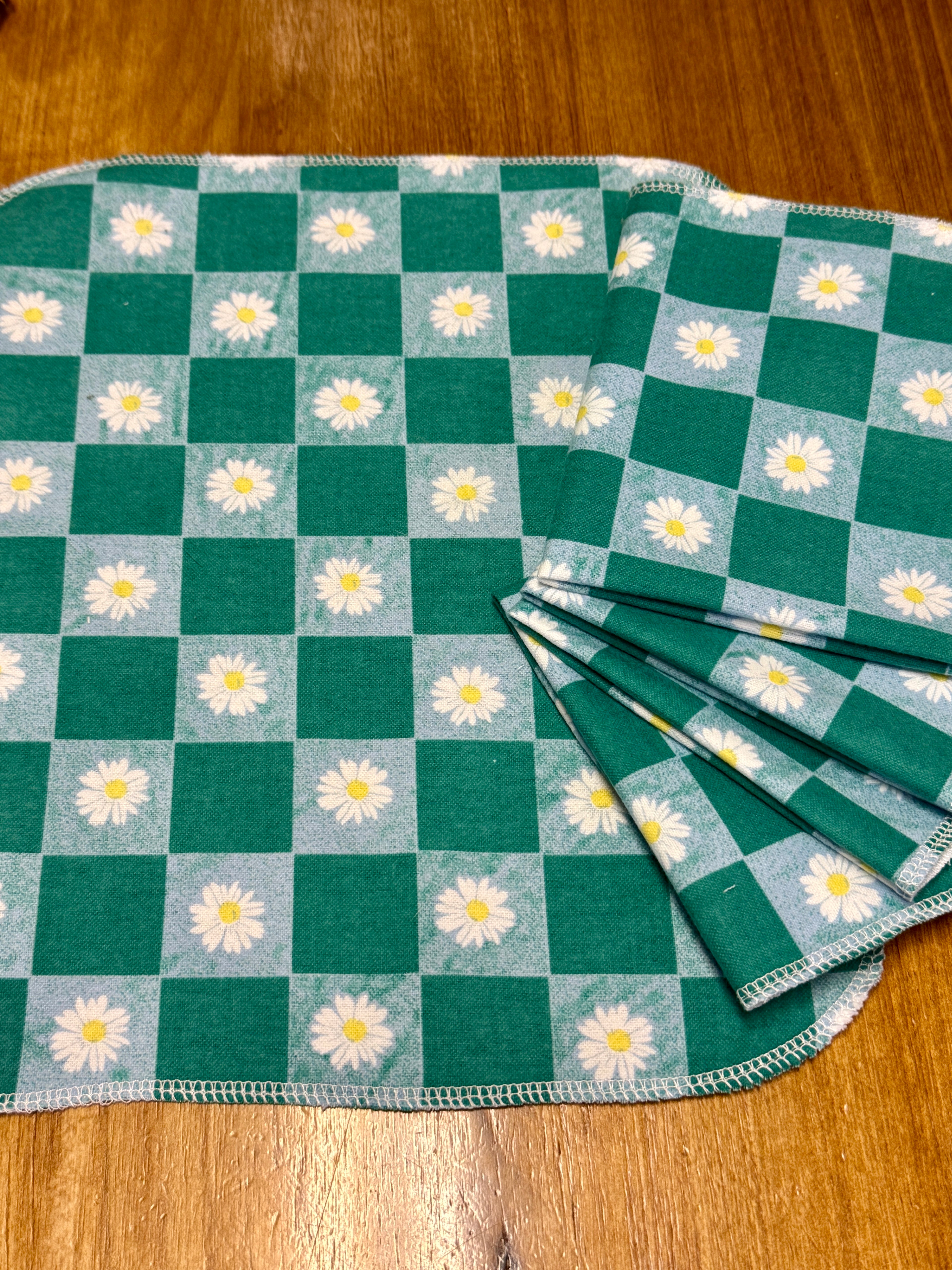 Green checkered towels with daisies