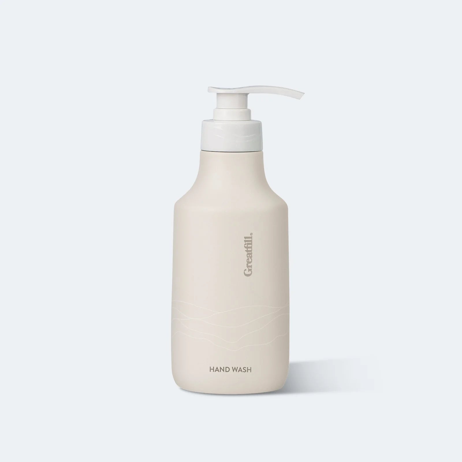 Beige hand wash bottle with pump on a white background