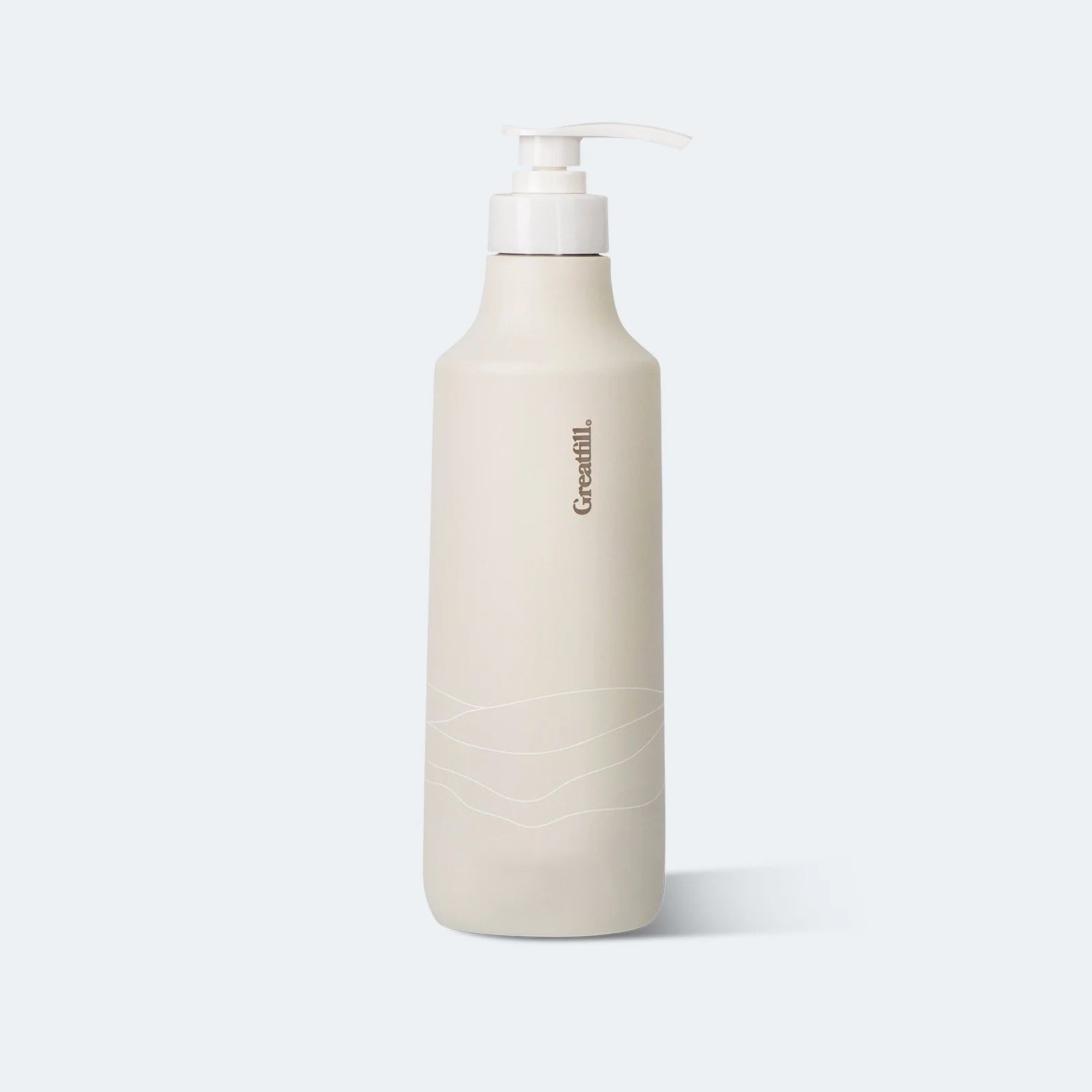 Beige bottle with pump on a light gray background