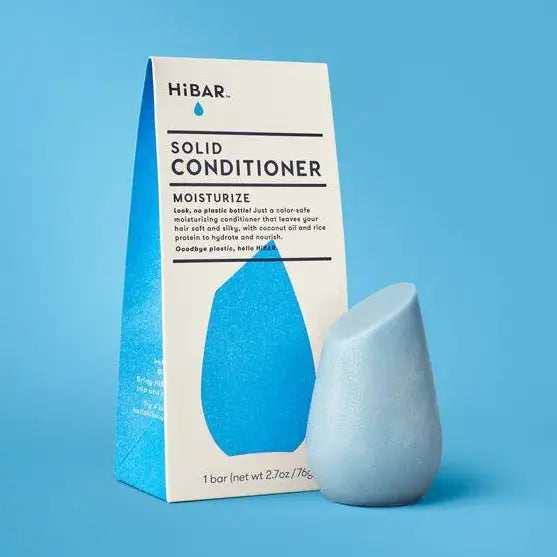 Solid conditioner bar and packaging on a blue background