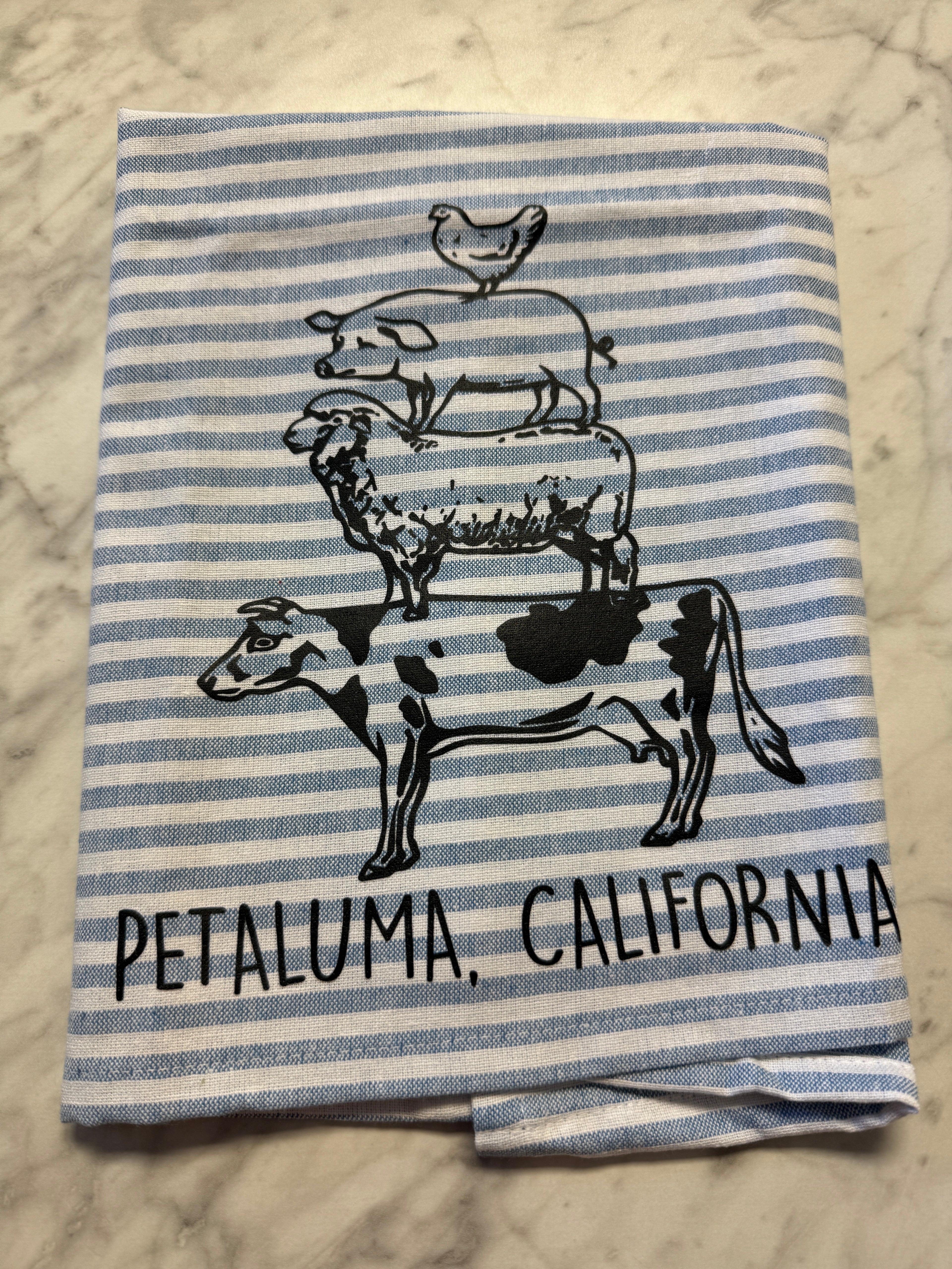 Striped towel with cow design and &