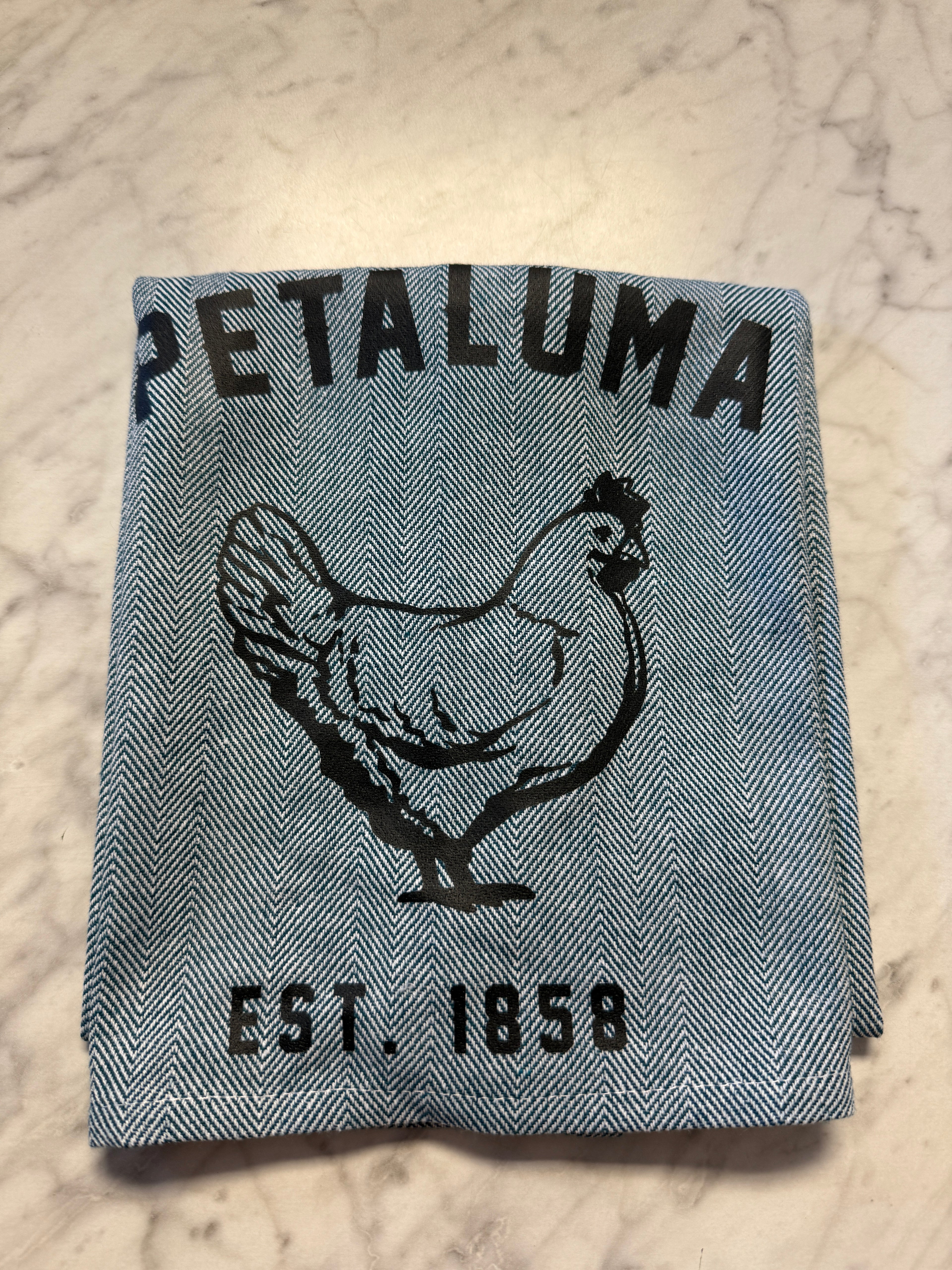 Gray fabric with black text and logo on a textured surface