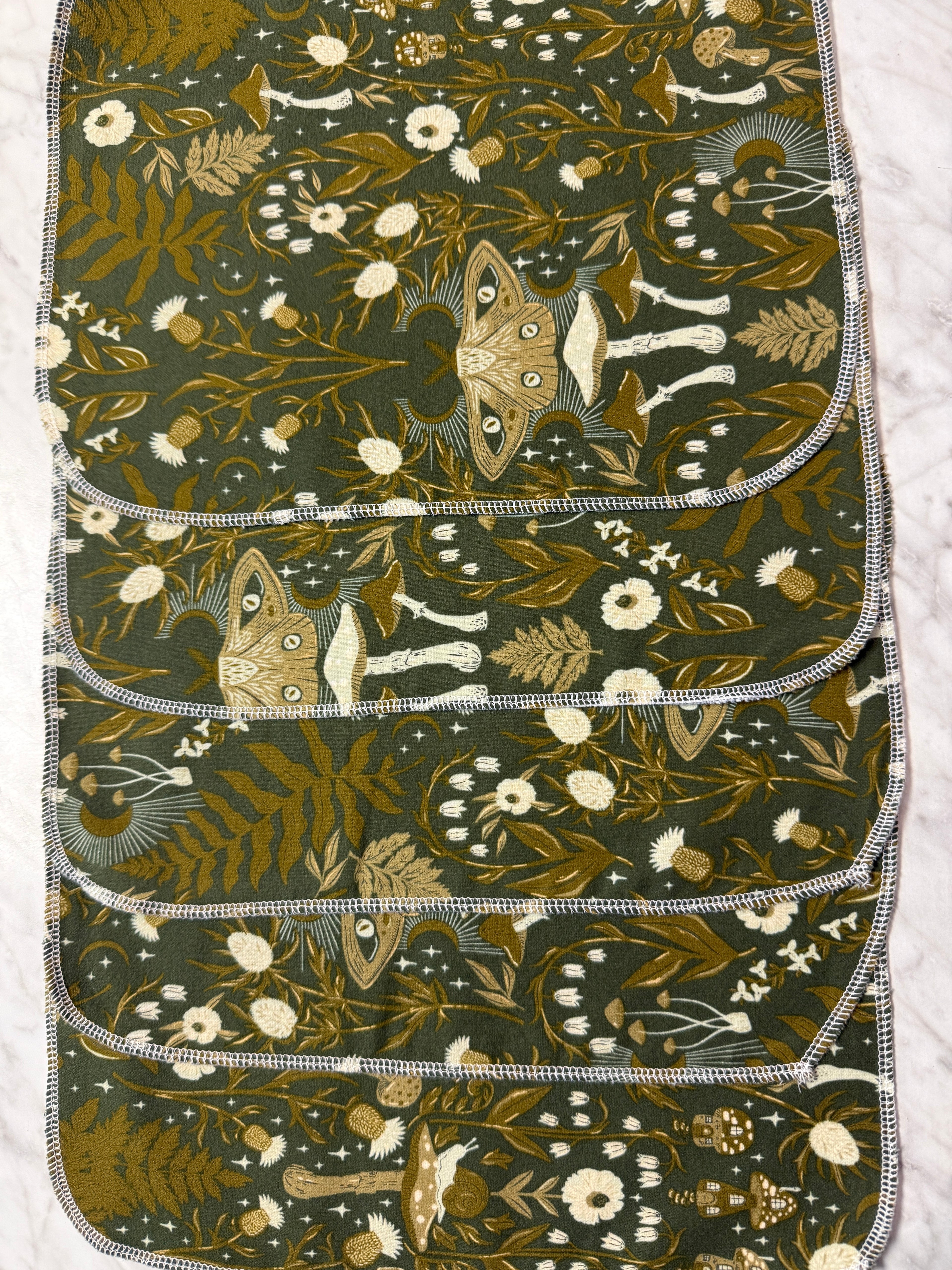 5 not paper towels with nature-themed pattern on a white background