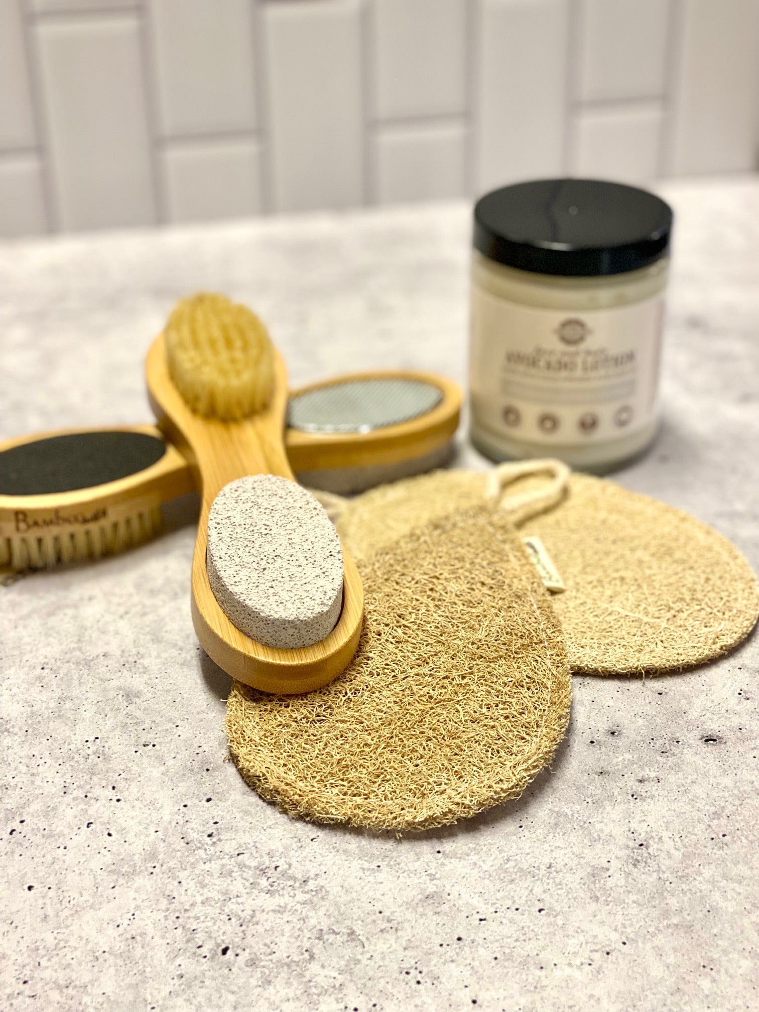 2 pedicure brushes, 2 loofah sponges, and 1 bottle of lotion
