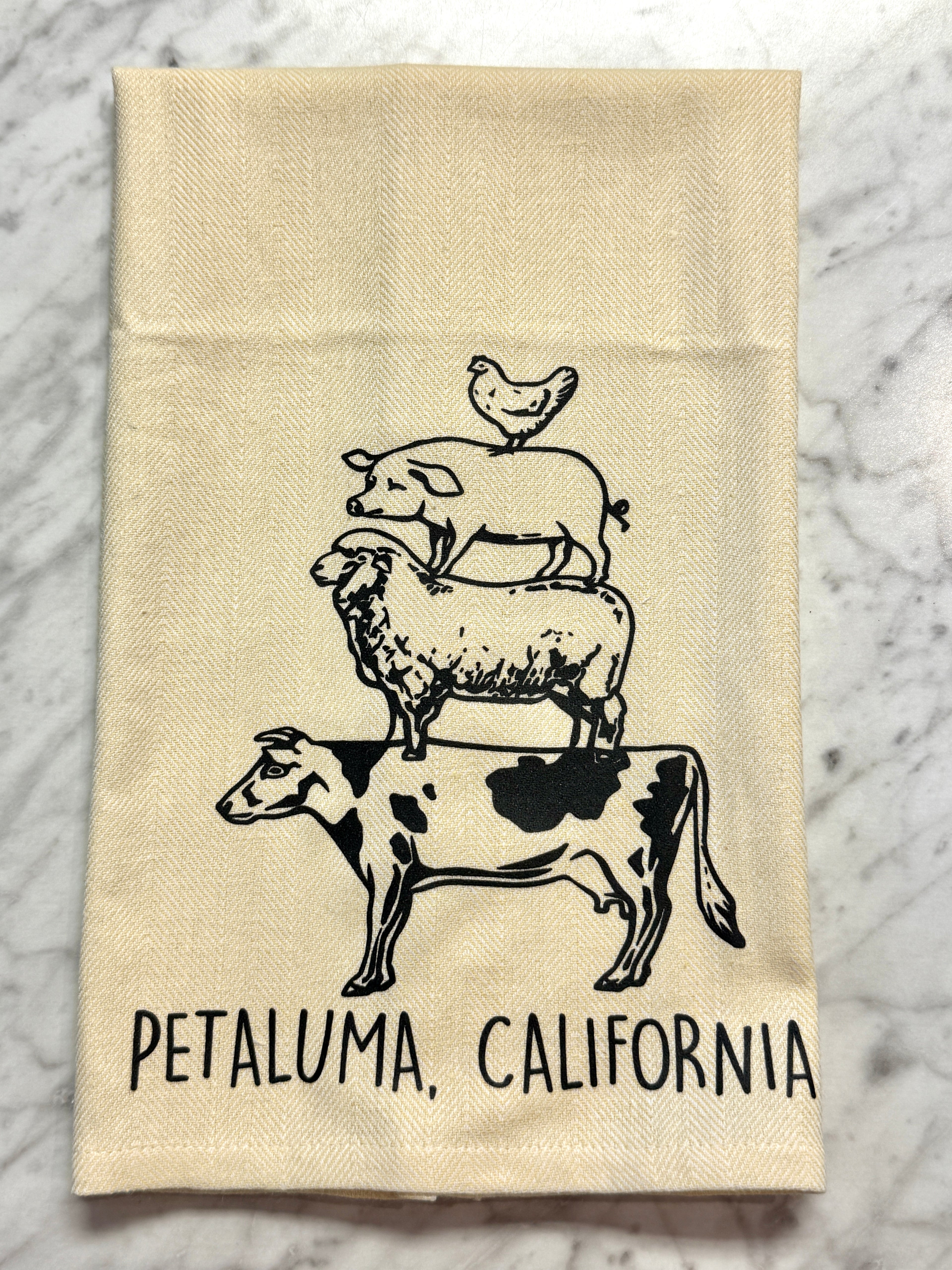 Yellow towel with black animal illustrations and &