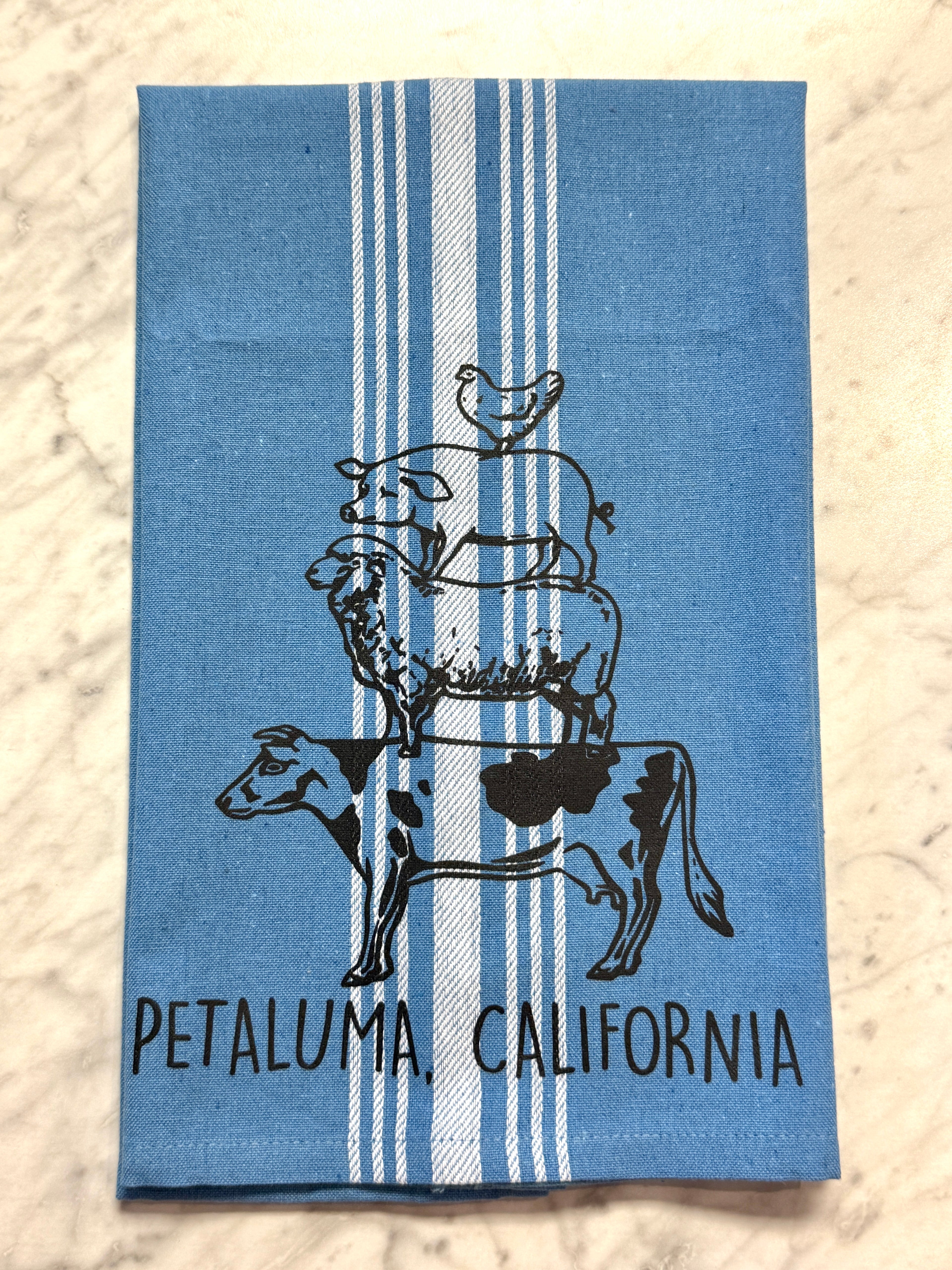 Blue towel with cow and chicken design and &