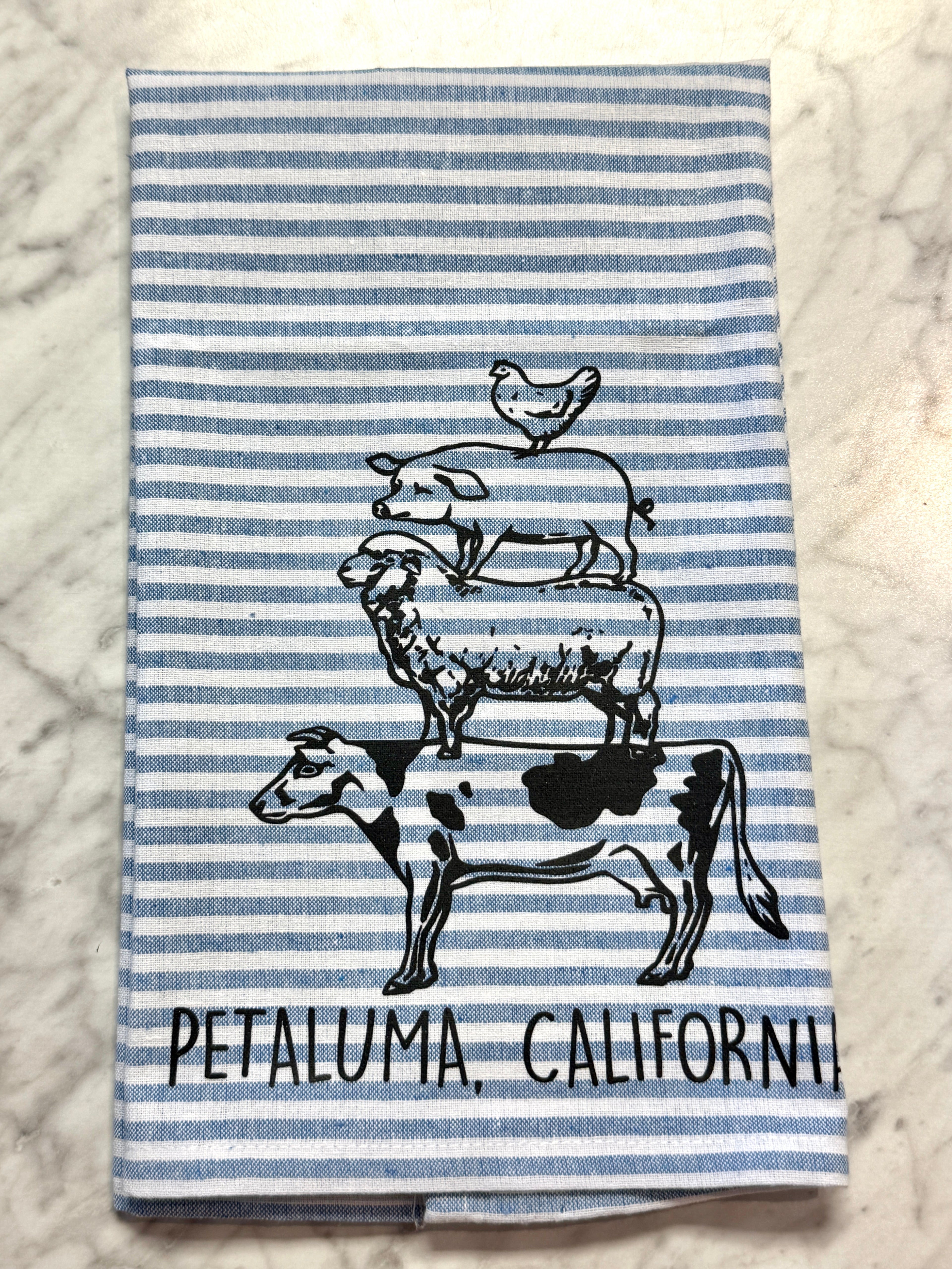 Striped towel with farm animal illustrations and &