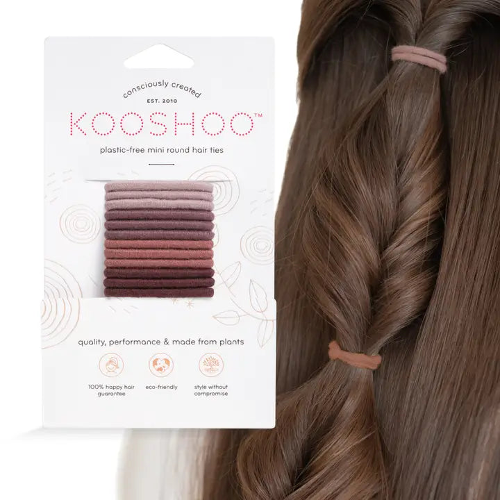 mini natural kooshoo rubber bands next to head with long brown hair