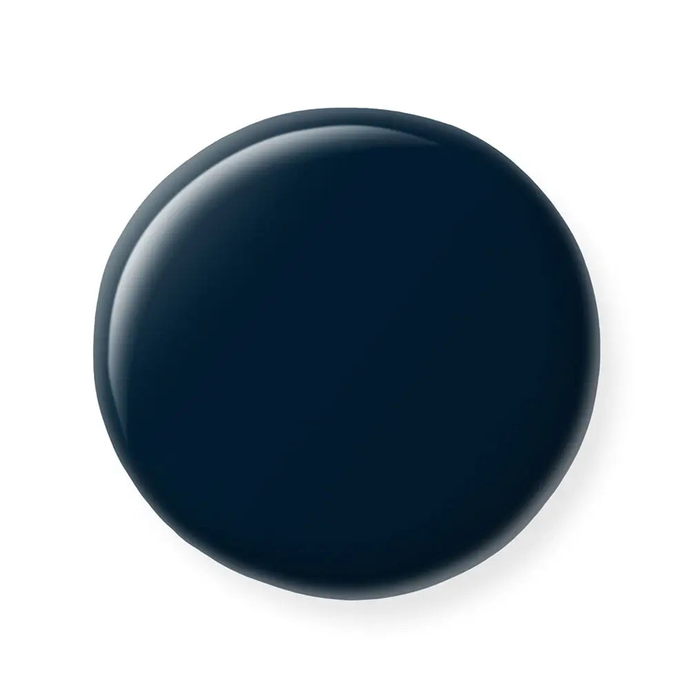 Navy blue nail polish sample on a white background