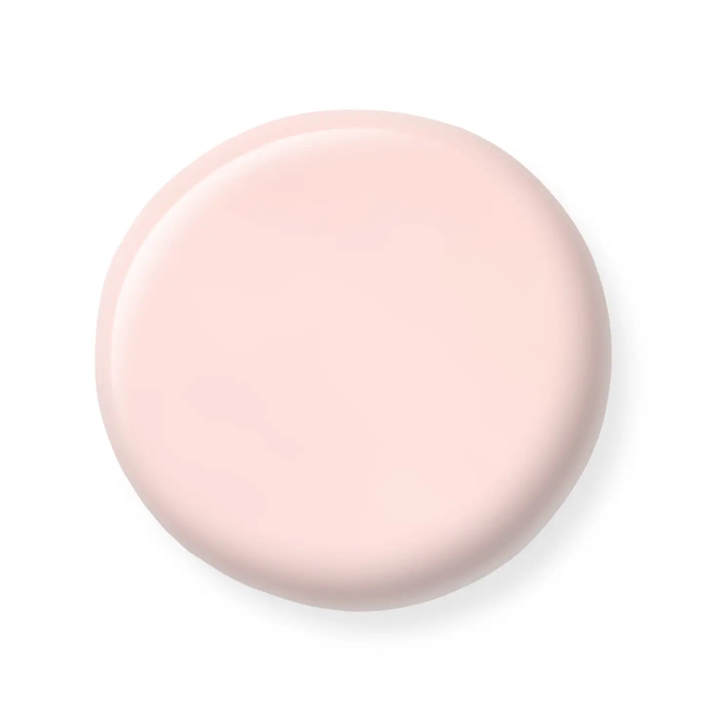 Round pink nail polish sample on a white background