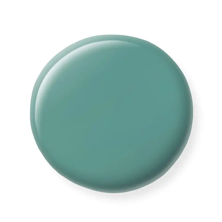 Teal-colored nail polish sample on a white background