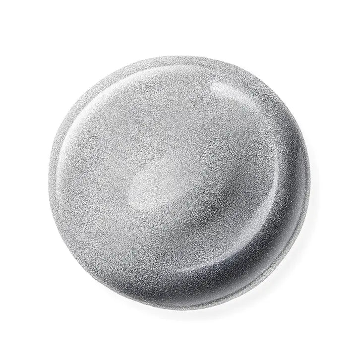 Round metallic nail polish sample on a white background