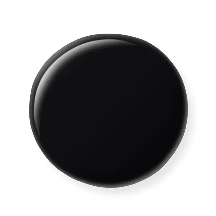 Black circular object on a white background