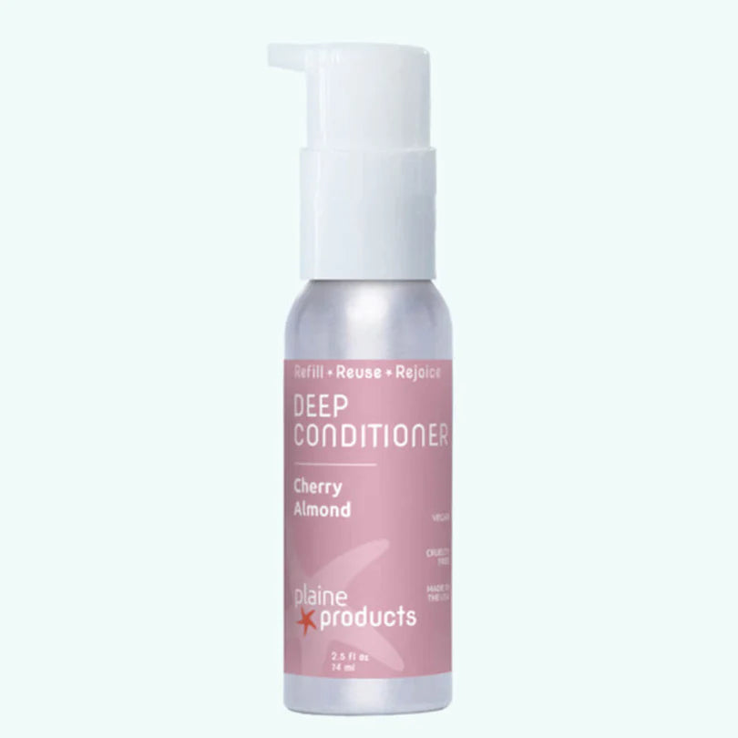 Plaine Products Deep Conditioner bottle with cherry almond scent on a white background