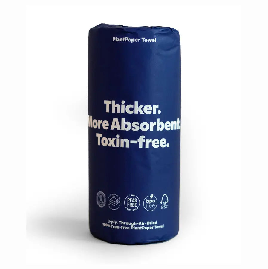 A single roll of Plant Paper Towels by Plant Paper, made from unbleached bamboo, wrapped in dark blue paper with “Thicker. More Absorbent. Toxin-free.” in white text and eco-friendly, toxin-free icons.