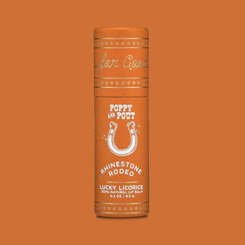 Lip balm container with branding on an orange background