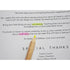 yellow highlighter pencil showing typed print behind