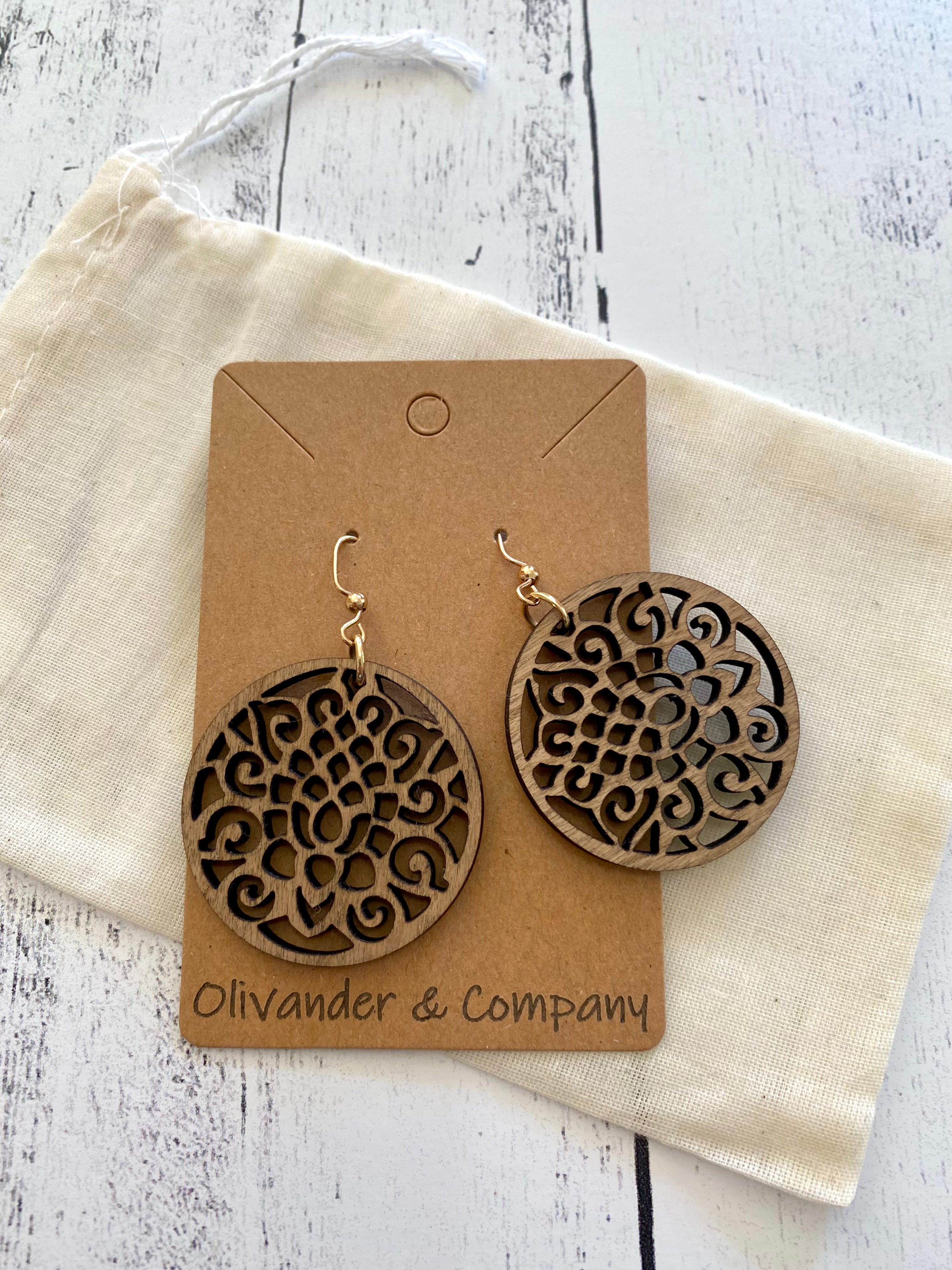 round wood laser earrings with muslin fabric pouch
