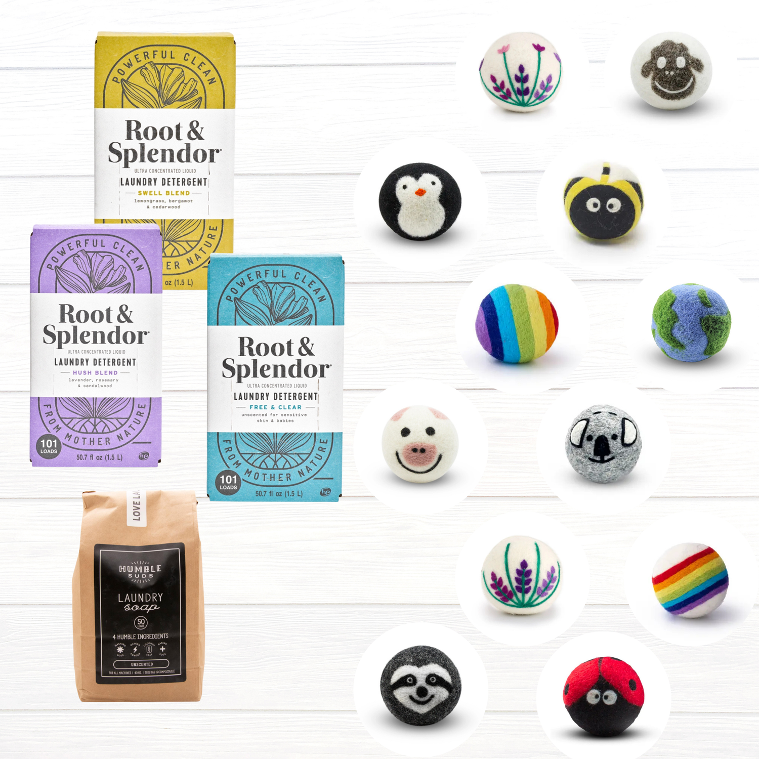 Three boxes and one bag of laundry detergent are shown alongside twelve colorful wool dryer balls decorated with animal faces, rainbows, flowers, and playful designs on a white background.