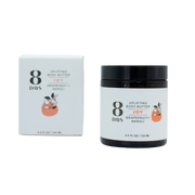 An 8 Days Body Butter jar with a black lid and a matching rectangular product box, both featuring a grapefruit illustration.