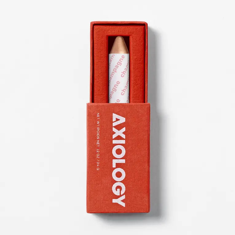Red Axiology box with a white product inside on a light gray background. 