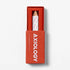 Red Axiology box with a white product inside on a light gray background. 