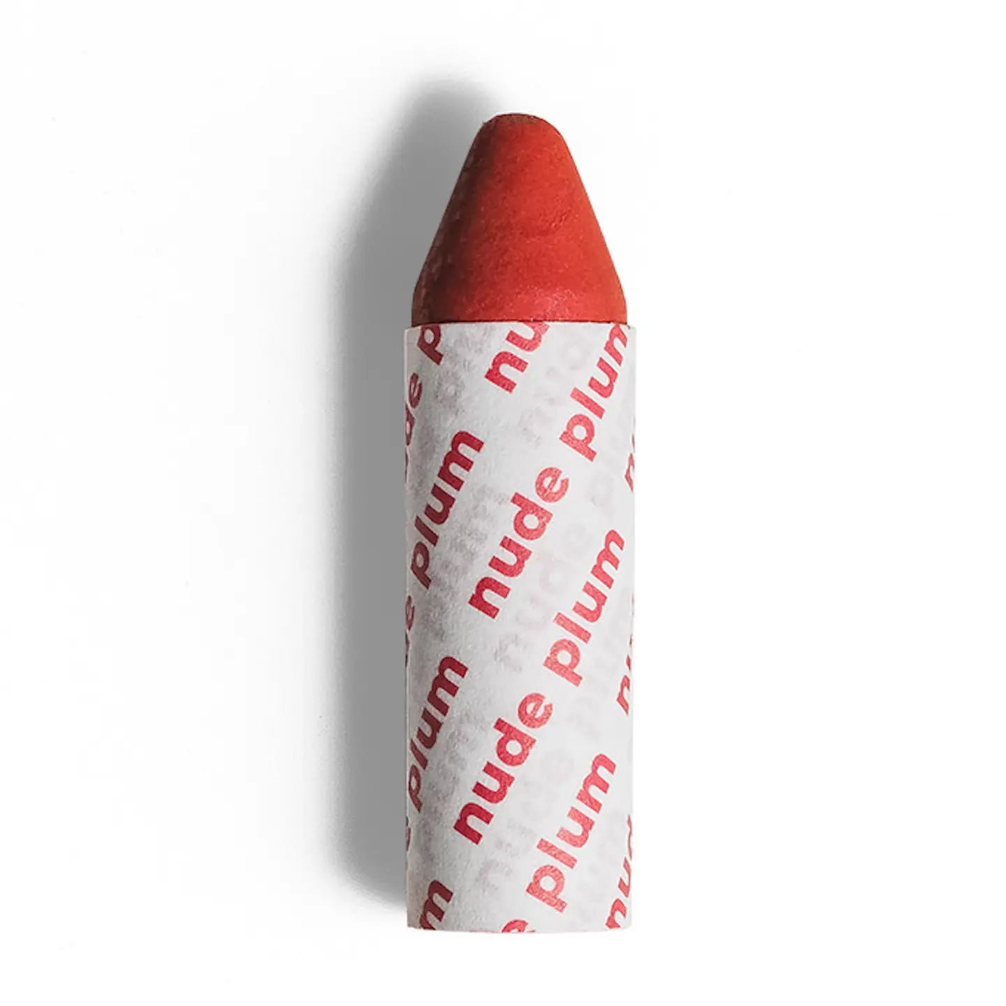 An Axiology 3-in-1 Balmie Crayon Single stands upright on a white surface, featuring a plastic-free design with a label that repeatedly displays "nude plum" in red on white. 