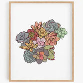 Framed artwork of colorful succulents on a white background