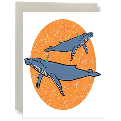 This eco-friendly Greeting Card by Bean Horse Car Designs shows two blue whales with water spouts over an orange textured oval and includes a white front plus gray envelope.