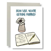 Bean Horse Car Designs’ eco-friendly Greeting Cards feature “HOLY SHIT, YOU’RE GETTING MARRIED,” a vase with a white flower, and an open Vows notebook with fun notes and pen, all in a unique design by a local artist.