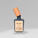 bkind grey blue nail polish in a bottle with lid tilted off