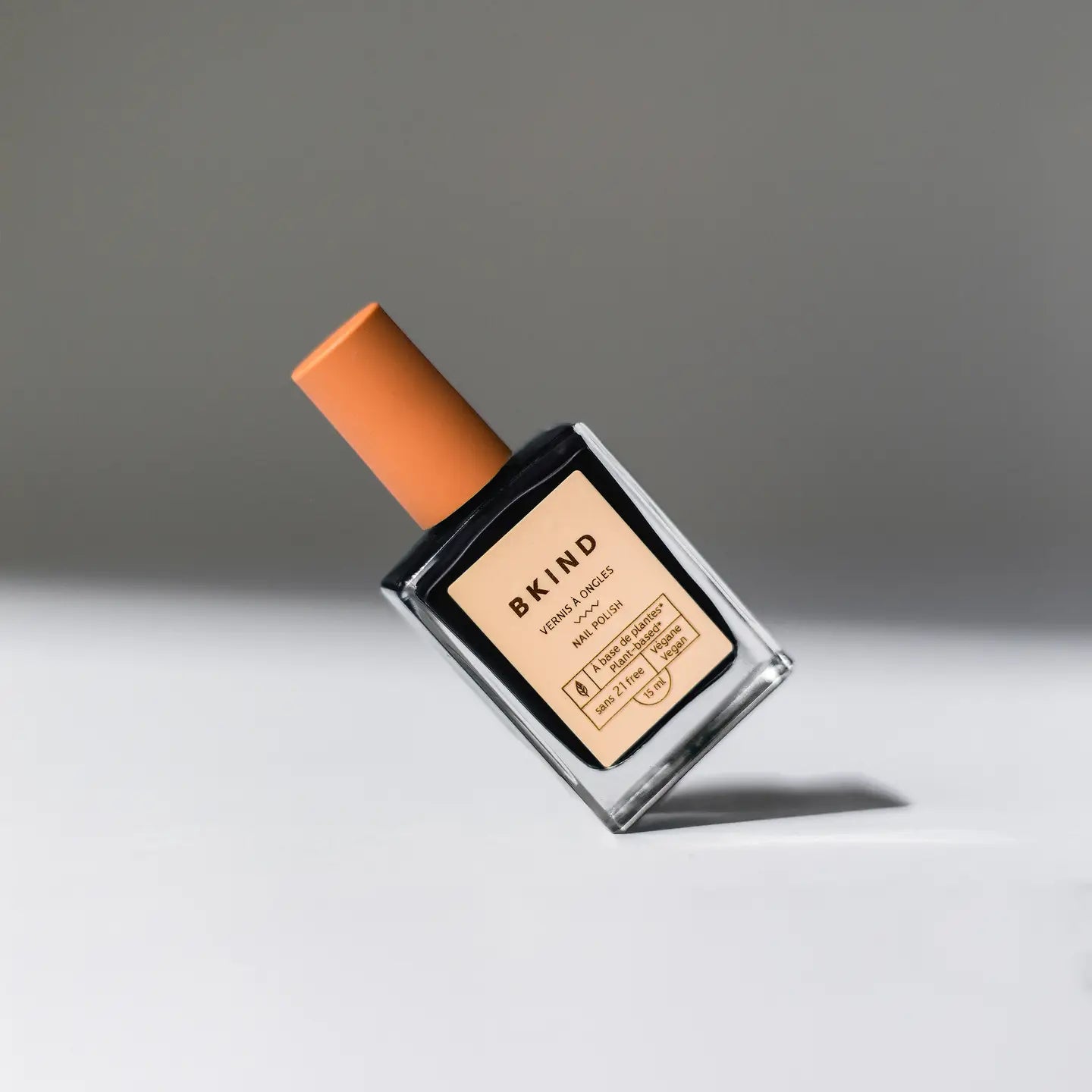 Perfume bottle with orange cap and &