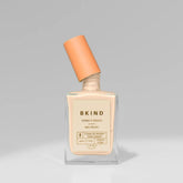 bottle of bkind nail polish in french beige with the lid barely off