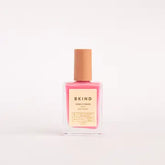 bottle of bkind nail polish in light pink