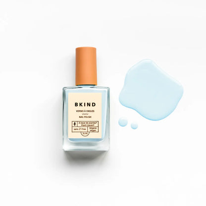 bkind nail polish in light blue with drops alongside