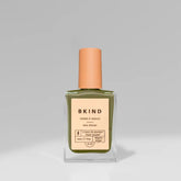 A bottle of BKind Nail Polish by BKind, featuring a peach cap and light peach label with green polish inside, is shown against a plain gray background.