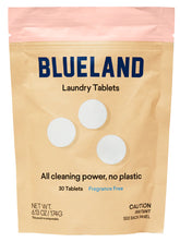 A beige and pink resealable pouch labeled Blueland Laundry Tablets, featuring 30 fragrance-free, plastic-free tablets made with clean ingredients. Includes caution for irritants. Three white tablets illustrated on the packaging.