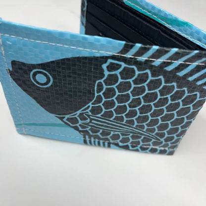 Blue and black fish-patterned wallet on a white background