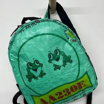 Green backpack with frog design and text on a white background