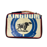 The Cement6 Lunch Box is a rectangular, artisan-made insulated bag with black edges, featuring a blue and white buffalo in a circular emblem and the word "KINGDOM" across the top—ideal for everyday use.