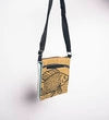 Small bag with a fish design on a plain background
