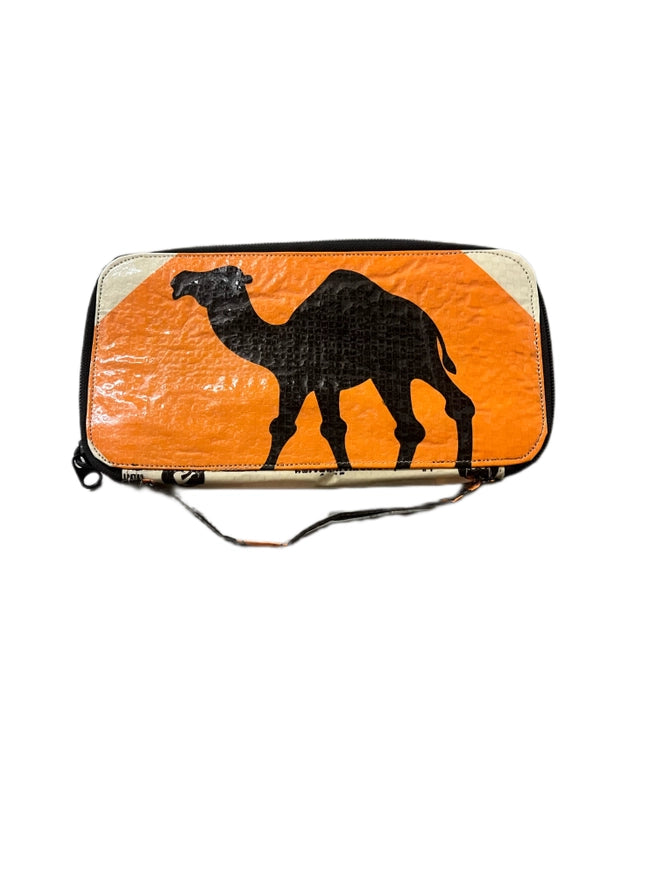 The Cement6 Zipped Clutch is a rectangular ethical wallet with an orange and white background, a black camel silhouette in the center, and a side strap—ideal for sustainable fashion fans.